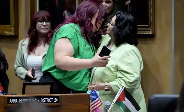 Democratic Arizona state senator Anna Hernandez, D-District 24, left, hugs a colleague after a their vote, Wednesday, May 1, 2024, at the Capitol in Phoenix. Democrats secured enough votes in the Arizona Senate to repeal a Civil War-era ban on abortions that the state's highest court recently allowed to take effect. (AP Photo/Matt York)