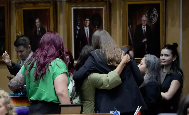 Democratic Arizona state senators hug after a their vote, Wednesday, May 1, 2024, at the Capitol in Phoenix. (AP Photo/Matt York)