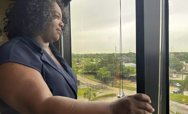 Louisiana Democratic state Rep. Delisha Boyd looks out the window at her office May 3, 2024, in New Orleans. As Boyd faces an uphill battle in Louisiana, as she attempts to advance a bill that would add cases of rape and incest as exceptions to Louisiana's near total abortion ban, the Democrat opens opening up about her mother's harrowing story and how it effected them. (AP Photo/Stephen Smith)