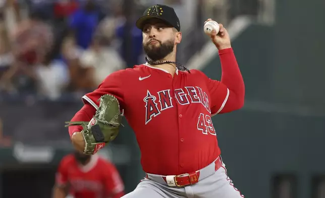 Los Angeles Angels starting pitcher Patrick Sandoval (43) delivers against the against the Texas Rangers in the third inning of a baseball game Saturday, May 18, 2024, in Arlington, Texas. (AP Photo/Richard W. Rodriguez)