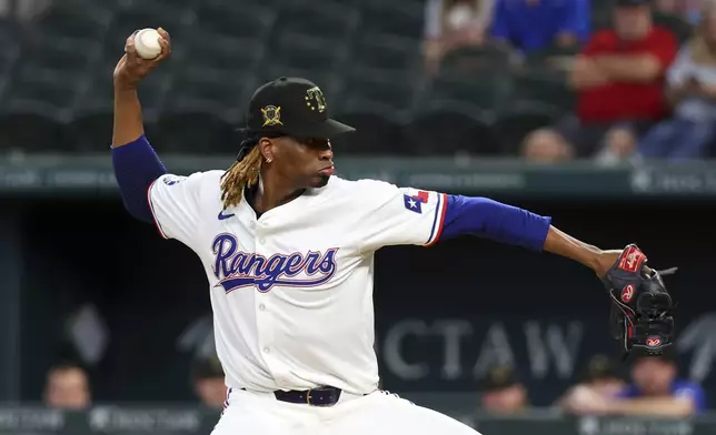 Texas Rangers starting pitcher Jose Urena delivers against the Los Angeles Angels in the first inning of a baseball game Saturday, May 18, 2024, in Arlington, Texas. (AP Photo/Richard W. Rodriguez)