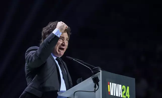 FILE - Argentina's president Javier Milei gestures as he delivers a speech on stage during the Spanish far-right wing party Vox's rally "Europa Viva 24" in Madrid, Spain, Sunday, May 19, 2024. A diplomatic crisis between historic allies Spain and Argentina expanded Tuesday, May 21, 2024, as Spain pulled its ambassador from Buenos Aires and Argentine President Javier Milei lambasted the move as “nonsense typical of an arrogant socialist.” (AP Photo/Manu Fernandez, File)