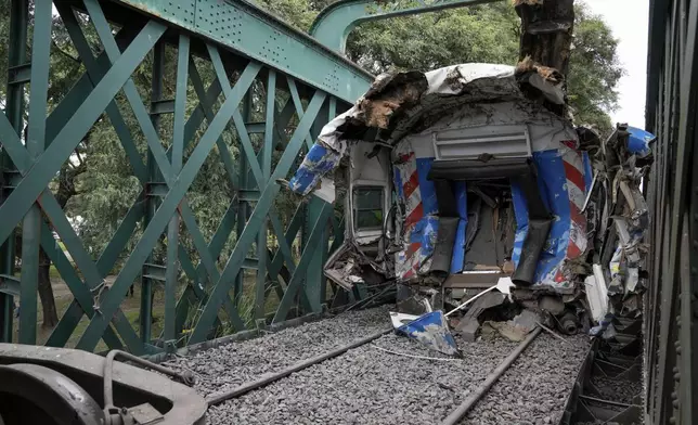 A train wagon that collided with another stands on the rails in Buenos Aires, Argentina, Friday, May 10, 2024. (AP Photo/Rodrigo Abd)