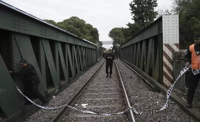 Police tape off the site after a passenger train collision in the Palermo area of Buenos Aires, Argentina, Friday, May 10, 2024. (AP Photo/Rodrigo Abd)