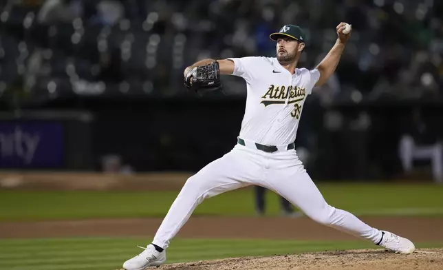 Oakland Athletics pitcher Kyle Muller throws to a Houston Astros batter during the seventh inning of a baseball game Friday, May 24, 2024, in Oakland, Calif. (AP Photo/Godofredo A. Vásquez)