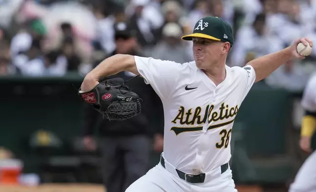 Oakland Athletics pitcher JP Sears throws to a Houston Astros batter during the first inning of a baseball game Saturday, May 25, 2024, in Oakland, Calif. (AP Photo/Godofredo A. Vásquez)