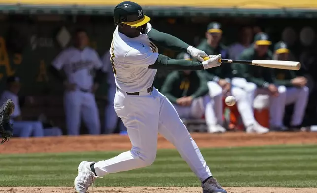 Oakland Athletics' Daz Cameron strikes out against the Houston Astros during the fourth inning of a baseball game Saturday, May 25, 2024, in Oakland, Calif. (AP Photo/Godofredo A. Vásquez)