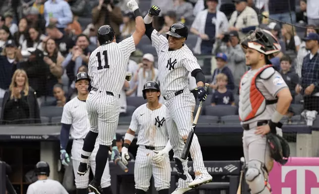 New York Yankees' Anthony Volpe, left, celebrates with Juan Soto after hitting a two-run home run during the third inning of a baseball game against the Houston Astros, Thursday, May 9, 2024, in New York. (AP Photo/Frank Franklin II)