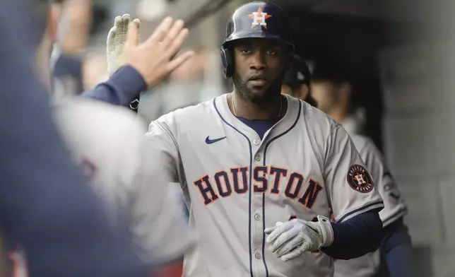 Houston Astros' Yordan Alvarez is congratulated after he scored against the New York Yankees during the fifth inning of a baseball game Thursday, May 9, 2024, in New York. (AP Photo/Frank Franklin II)