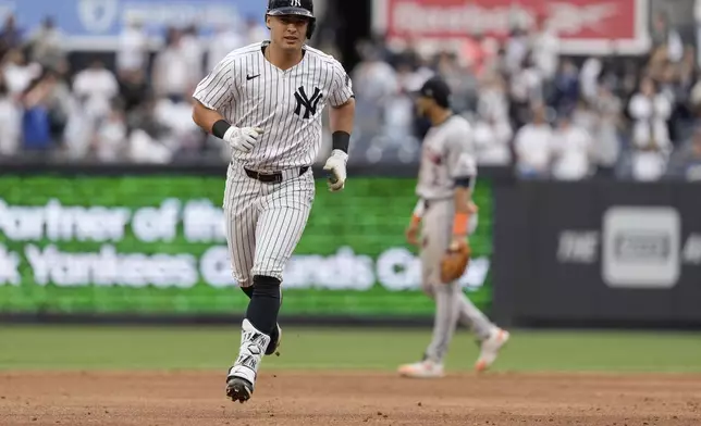 New York Yankees' Anthony Volpe runs the bases after hitting a two-run home run during the third inning of a baseball game against the Houston Astros, Thursday, May 9, 2024, in New York. (AP Photo/Frank Franklin II)