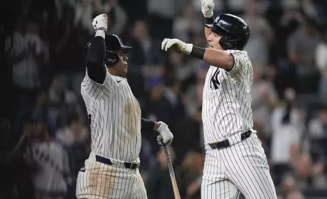 New York Yankees' Anthony Volpe, right, celebrates with Juan Soto after Volpe hit a two-run home run during the fourth inning of a baseball game against the Houston Astros, Tuesday, May 7, 2024, in New York. (AP Photo/Frank Franklin II)