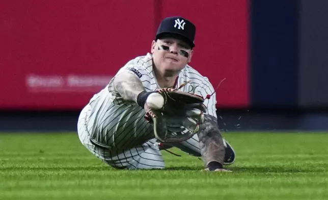 New York Yankees' Alex Verdugo catches a ball hit by Houston Astros' Jeremy Peña for an out during the sixth inning of a baseball game Tuesday, May 7, 2024, in New York. (AP Photo/Frank Franklin II)