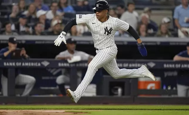 New York Yankees' Juan Soto runs to home plate to score on a single by Alex Verdugo during the third inning of a baseball game against the Houston Astros, Tuesday, May 7, 2024, in New York. (AP Photo/Frank Franklin II)