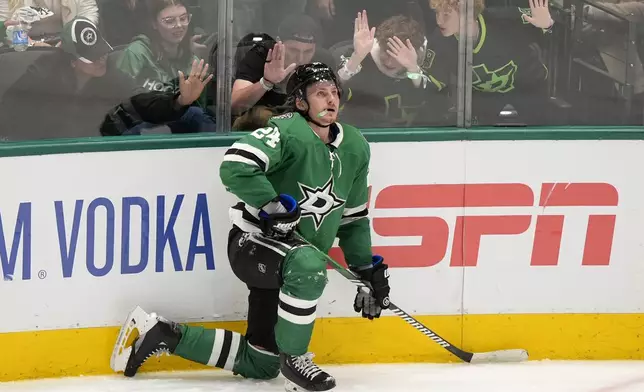 Dallas Stars center Roope Hintz kneels on the ice after being issued a penalty for embelishment in the third period in Game 2 of an NHL hockey Stanley Cup second-round playoff series against the Colorado Avalanche in Dallas, Tuesday, May 7, 2024. (AP Photo/LM Otero)