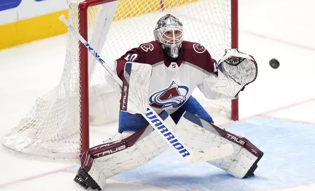 Colorado Avalanche goaltender Alexandar Georgiev defends against a shot by the Dallas Stars in the third period in Game 2 of an NHL hockey Stanley Cup second-round playoff series in Dallas, Tuesday, May 7, 2024. (AP Photo/LM Otero)