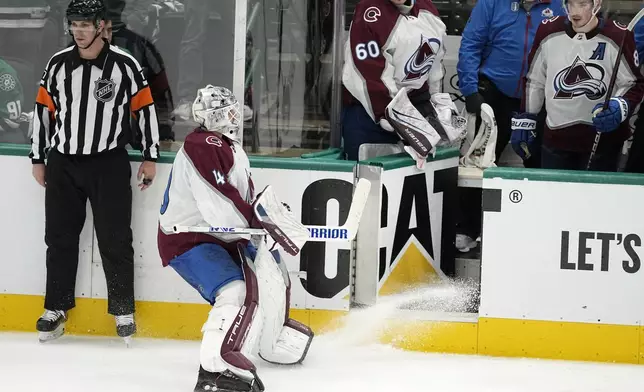 Colorado Avalanche goaltender Alexandar Georgiev skates to the bench late in the third period in Game 2 of the team's NHL hockey Stanley Cup second-round playoff series against the Dallas Stars in Dallas, Thursday, May 9, 2024. (AP Photo/Tony Gutierrez)