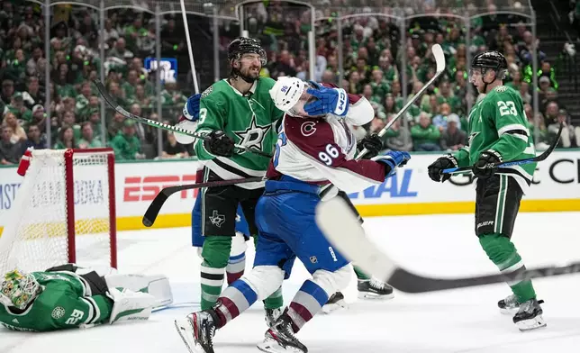 Colorado Avalanche right wing Mikko Rantanen (96) reacts after receiving a high stick from Dallas Stars defenseman Chris Tanev (3) during the second period in Game 5 of an NHL hockey Stanley Cup second-round playoff series, Wednesday, May 15, 2024, in Dallas. (AP Photo/Tony Gutierrez)