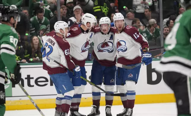 Colorado Avalanche's Artturi Lehkonen (62), Mikko Rantanen, second from left, Cale Makar (8) and Valeri Nichushkin (13) celbrate a goal scored by Makar in the second period in Game 2 of an NHL hockey Stanley Cup second-round playoff series against the Dallas Stars in Dallas, Tuesday, May 7, 2024. (AP Photo/LM Otero)