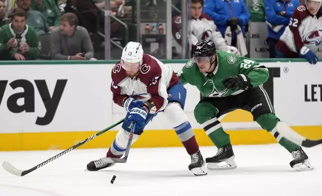Colorado Avalanche right wing Valeri Nichushkin (13) takes control of the puck on an attack in front of Dallas Stars center Roope Hintz (24) in the second period in Game 2 of an NHL hockey Stanley Cup second-round playoff series in Dallas, Tuesday, May 7, 2024. (AP Photo/LM Otero)