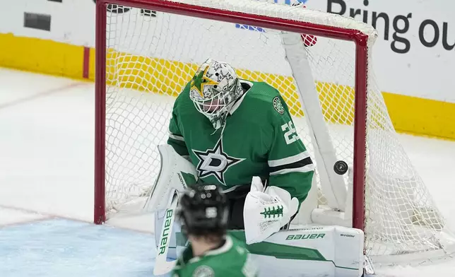 A shot by Colorado Avalanche defenseman Cale Makar, not visible, gets by Dallas Stars goaltender Jake Oettinger (29) for a goal during the third period in Game 5 of an NHL hockey Stanley Cup second-round playoff series, Wednesday, May 15, 2024, in Dallas. (AP Photo/Tony Gutierrez)