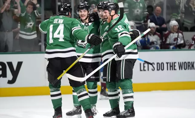 Dallas Stars' Jamie Benn (14), Wyatt Johnston, from left rear, Nils Lundkvist and Joe Pavelski (16) celebrate after Johnston scored in the first period in Game 2 of an NHL hockey Stanley Cup second-round playoff series against the Colorado Avalanche in Dallas, Tuesday, May 7, 2024. (AP Photo/LM Otero)