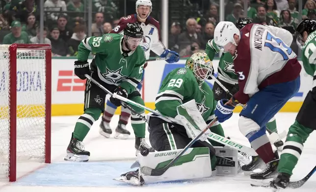 Dallas Stars goaltender Jake Oettinger (29) is unable to stop a shot from Colorado Avalanche right wing Valeri Nichushkin that would score as the Stars' Evgenii Dadonov (63) looks on in the second period in Game 2 of an NHL hockey Stanley Cup second-round playoff series in Dallas, Tuesday, May 7, 2024. (AP Photo/LM Otero)
