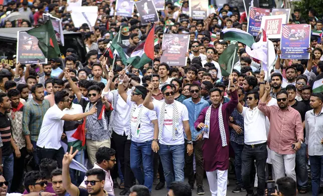 Bangladeshi students wave Palestinian flags, as they march during a pro- Palestinian demonstration at the Dhaka University area in Dhaka, Bangladesh, Monday, May 6, 2024. (AP Photo/ Mahmud Hossain Opu )