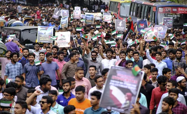 Bangladeshi students wave Palestinian flags, as they march during a pro- Palestinian demonstration at the Dhaka University area in Dhaka, Bangladesh, Monday, May 6, 2024. (AP Photo/ Mahmud Hossain Opu )