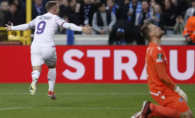 Fiorentina's Lucas Beltran, left, celebrates after scoring his sides first goal on a penalty during the Europa Conference League semi-final second leg soccer match between Club Brugge and Fiorentina at the Jan Breydel Stadium in Bruges, Belgium, Wednesday, May 8, 2024. (AP Photo/Omar Havana)
