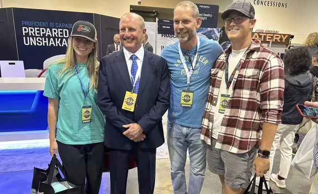 Berkshire Hathaway Vice Chairman Greg Abel poses with shareholders Friday, May 3, 2024, in Omaha, Neb. Abel is set to be the next CEO after Warren Buffett is gone. (AP Photo/Josh Funk)