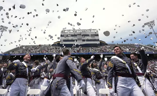 West Point graduates toss their caps into the air at the conclusion of the U.S. Military Academy commencement ceremony, Saturday, May 25, 2024, in West Point, N.Y. (AP Photo/Alex Brandon)