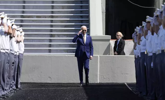President Joe Biden salutes as he walks to speak to graduating cadets at the U.S. Military Academy commencement ceremony, Saturday, May 25, 2024, in West Point, N.Y. (AP Photo/Alex Brandon)
