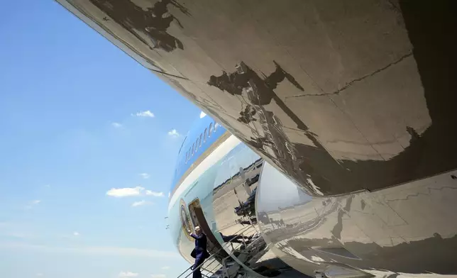 President Joe Biden waves as he arrives on Air Force One at Charlotte Douglas International Airport, Thursday, May 2, 2024, in Charlotte, N.C. Biden met with the families of law enforcement officers shot to death on the job. (AP Photo/Alex Brandon)