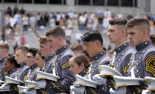 Graduating cadets bow their heads during a prayer at the U.S. Military Academy commencement ceremony, Saturday, May 25, 2024, in West Point, N.Y. (AP Photo/Alex Brandon)