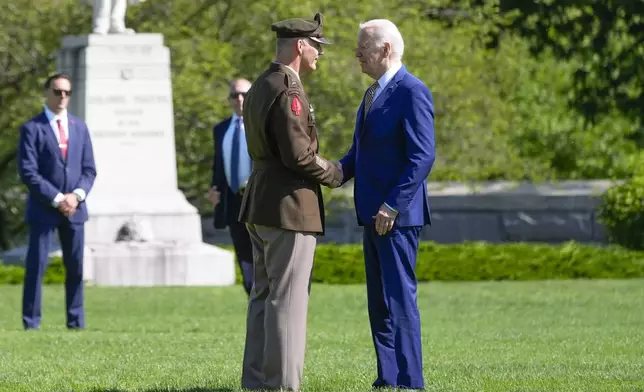 President Joe Biden, right, is greeted by Lt. General Steve Gillard, left, Superintendent at the U.S. Military Academy at West Point, Saturday, May 25, 2024, in West Point, N.Y. (AP Photo/Alex Brandon)