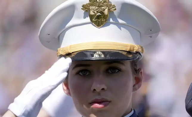 A graduating cadet stands during the playing of the national anthem at the U.S. Military Academy commencement ceremony, Saturday, May 25, 2024, in West Point, N.Y. (AP Photo/Alex Brandon)