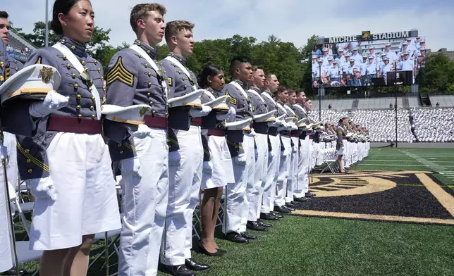 Graduating cadets stand during the singing of "The Corps" after President Joe Biden spoke to graduating cadets at the U.S. Military Academy commencement ceremony, Saturday, May 25, 2024, in West Point, N.Y. (AP Photo/Alex Brandon)