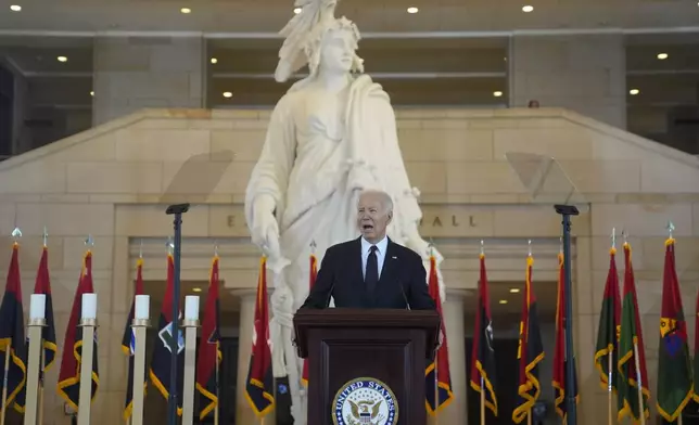 President Joe Biden speaks at the U.S. Holocaust Memorial Museum's Annual Days of Remembrance ceremony at the U.S. Capitol, Tuesday, May 7, 2024 in Washington. Statue of Freedom stands behind. (AP Photo/Evan Vucci)