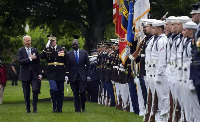 President Joe Biden and Kenya's President William Ruto review the troops with Col. David Rowland, commander of the 3rd U.S. Infantry Regiment, The Old Guard, during a State Arrival Ceremony on the South Lawn of the White House in Washington, Thursday, May 23. 2024. (AP Photo/Evan Vucci)