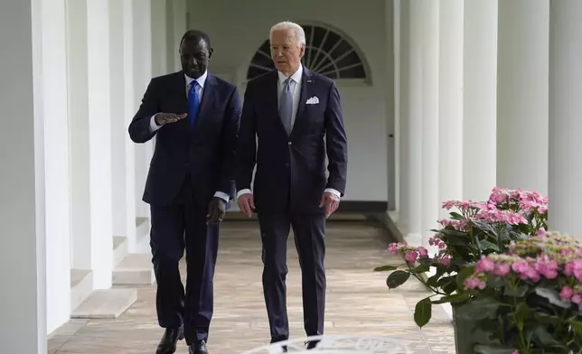 President Joe Biden and Kenya's President William Ruto walk along the Colonnade around the Rose Garden on their way to the Oval Office for a meeting after a State Arrival Ceremony at the White House, Thursday, May 23, 2024, in Washington. (AP Photo/Evan Vucci, Pool)