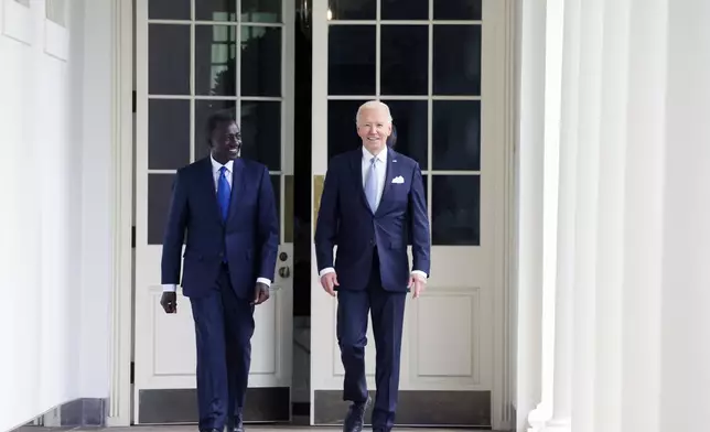 President Joe Biden and Kenyan President William Ruto walk along the Colonnade around the Rose Garden on their way to the Oval Office for a meeting after a State Arrival Ceremony at the White House, Thursday, May 23, 2024, in Washington. (Leah Millis/Pool Photo via AP)