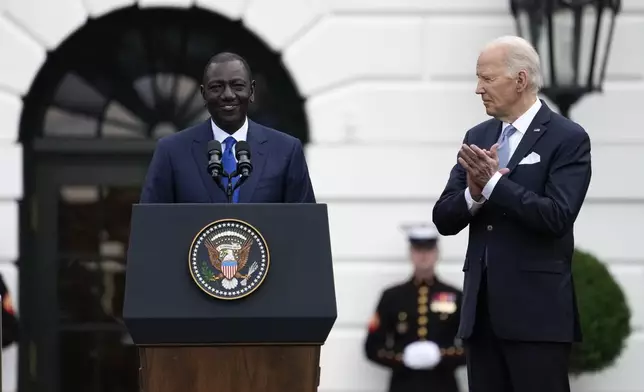 Kenya's President William Ruto speaks as President Joe Biden looks on, during a State Arrival Ceremony on the South Lawn of the White House in Washington, Thursday, May 23, 2024. (AP Photo/Susan Walsh)