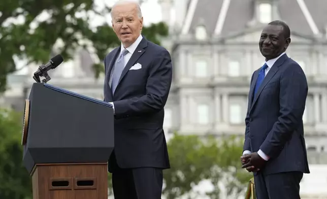 President Joe Biden speaks Kenya's President William Ruto listens during a State Arrival Ceremony Thursday, May 23, 2024, on the South Lawn of the White House in Washington. (AP Photo/Jacquelyn Martin)