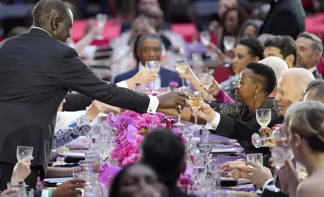 Kenya's President William Ruto exchanges a toast with President Joe Biden during a State Dinner at the White House, Thursday, May 23, 2024, in Washington. (AP Photo/Evan Vucci)