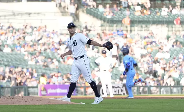 Detroit Tigers starting pitcher Jack Flaherty walks behind the mound as Toronto Blue Jays' Isiah Kiner-Falefa rounds the bases after his solo home run during the third inning of a baseball game, Thursday, May 23, 2024, in Detroit. (AP Photo/Carlos Osorio)