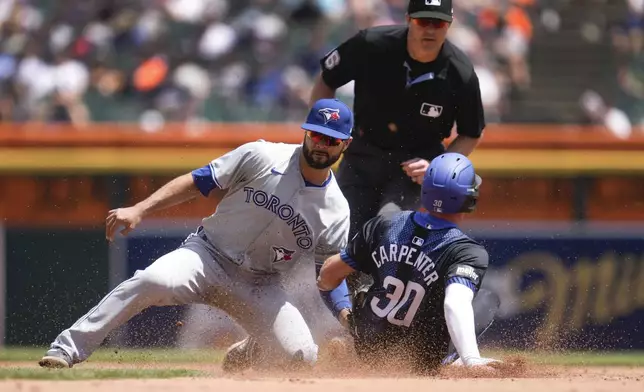 Toronto Blue Jays second baseman Isiah Kiner-Falefa tags Detroit Tigers' Kerry Carpenter (30) out attempting to steal second base in the fourth inning of a baseball game, Saturday, May 25, 2024, in Detroit. (AP Photo/Paul Sancya)