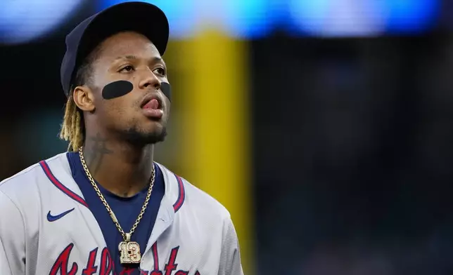 Atlanta Braves right fielder Ronald Acuña Jr. walks back to the dugout after the fifth inning of a baseball game against the Seattle Mariners, Tuesday, April 30, 2024, in Seattle. (AP Photo/Lindsey Wasson)