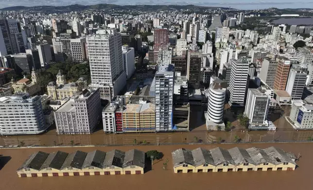 The area near the Guaiba River is flooded after heavy rain in Porto Alegre, Rio Grande do Sul state, Brazil, Thursday, May 9, 2024. (AP Photo/Andre Penner)