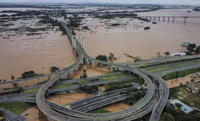 An aerial view of an area flooded by heavy rains, in Porto Alegre, Rio Grande do Sul state, Brazil, Friday, May 3, 2024. (AP Photo/Carlos Macedo)