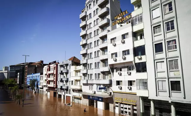 A street is flooded after heavy rain in Porto Alegre, Rio Grande do Sul state, Brazil, Monday, May 6, 2024. (AP Photo/Carlos Macedo)